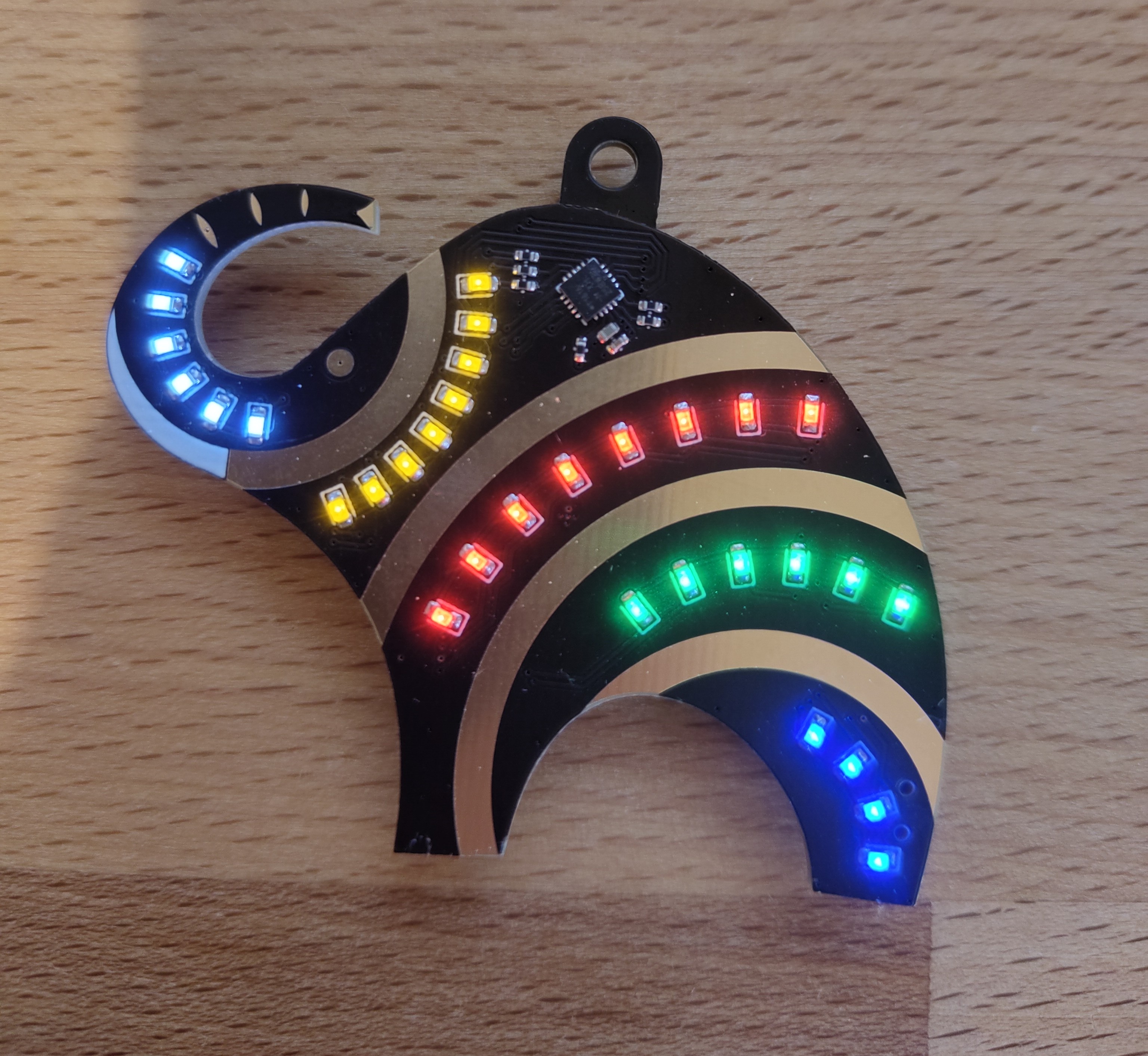 A black PCB with LEDS in the shape of a elephant